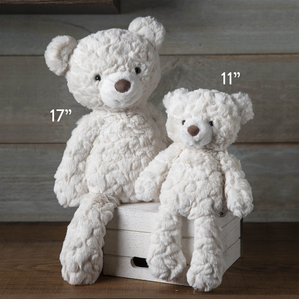 Putty Bear cream pose in crib demonstrating nursery-friendly display