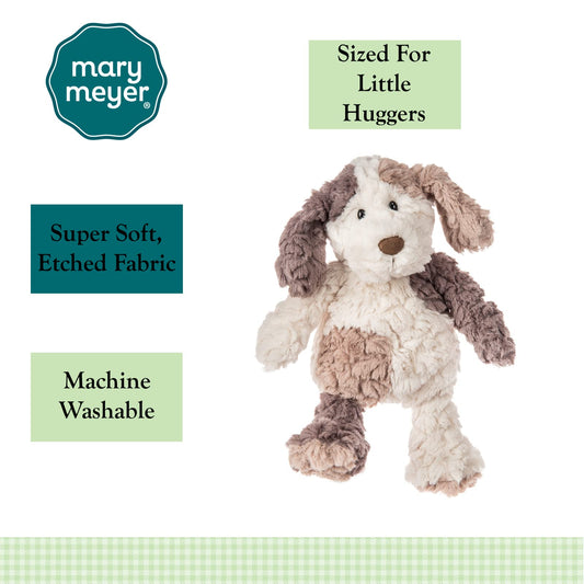 Close-up of Cooper Pup's floppy ears and soft nose for gentle tactile play.