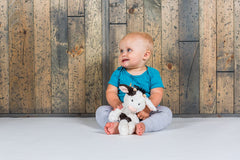 Mary Meyer Putty Nursery Cow weighted bum and feet for a secure snuggle.