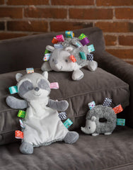 Mary Meyer Taggies Harley Raccoon Lovey with satin tags for tactile exploration.