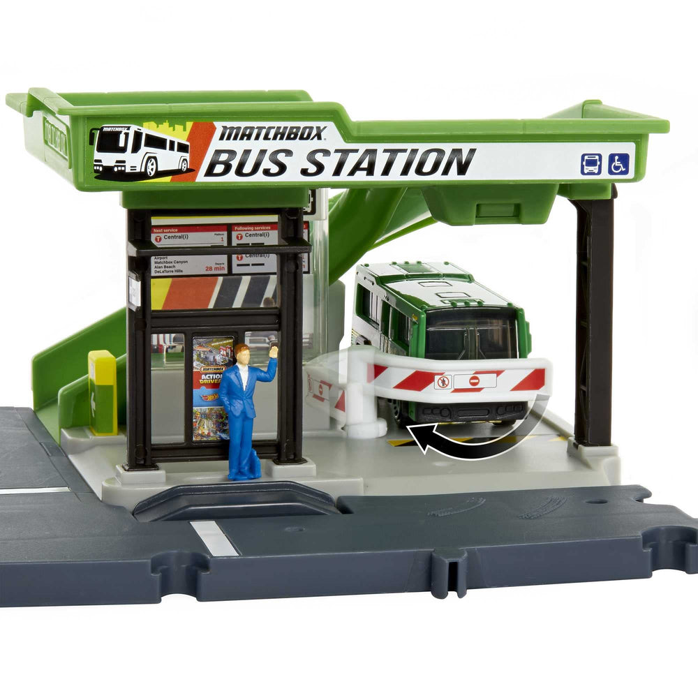 Matchbox bus station door opens as passengers board for dynamic play.