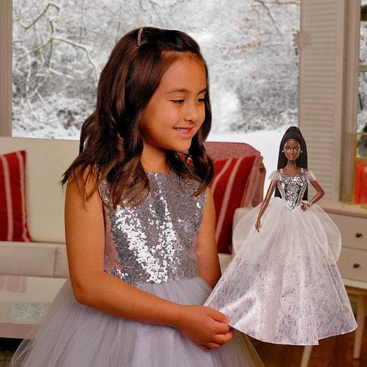Barbie Signature 2021 Holiday doll silver gown highlights metallic bodice for glamorous shelf presence.