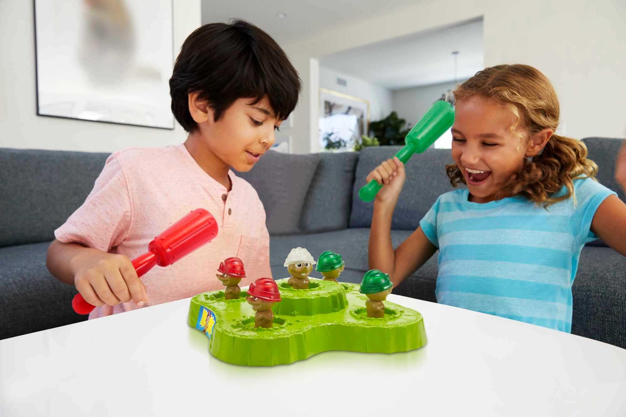 Mattel Games WHAC-A-MOLE arcade moles light up to boost focus and fun.