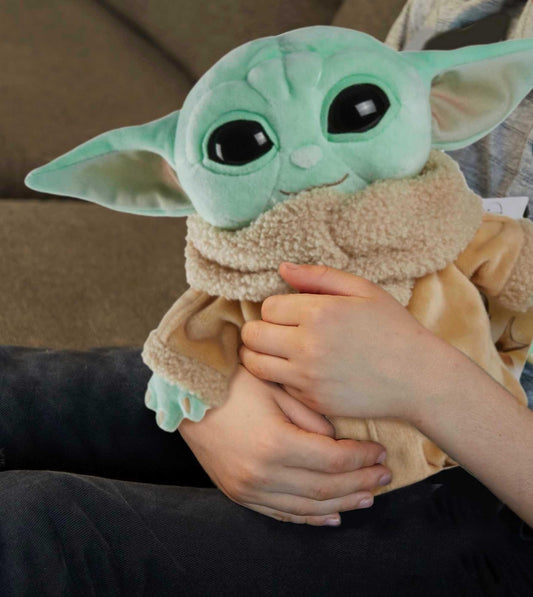 Mattel Grogu plush close-up face highlights green skin and large eyes