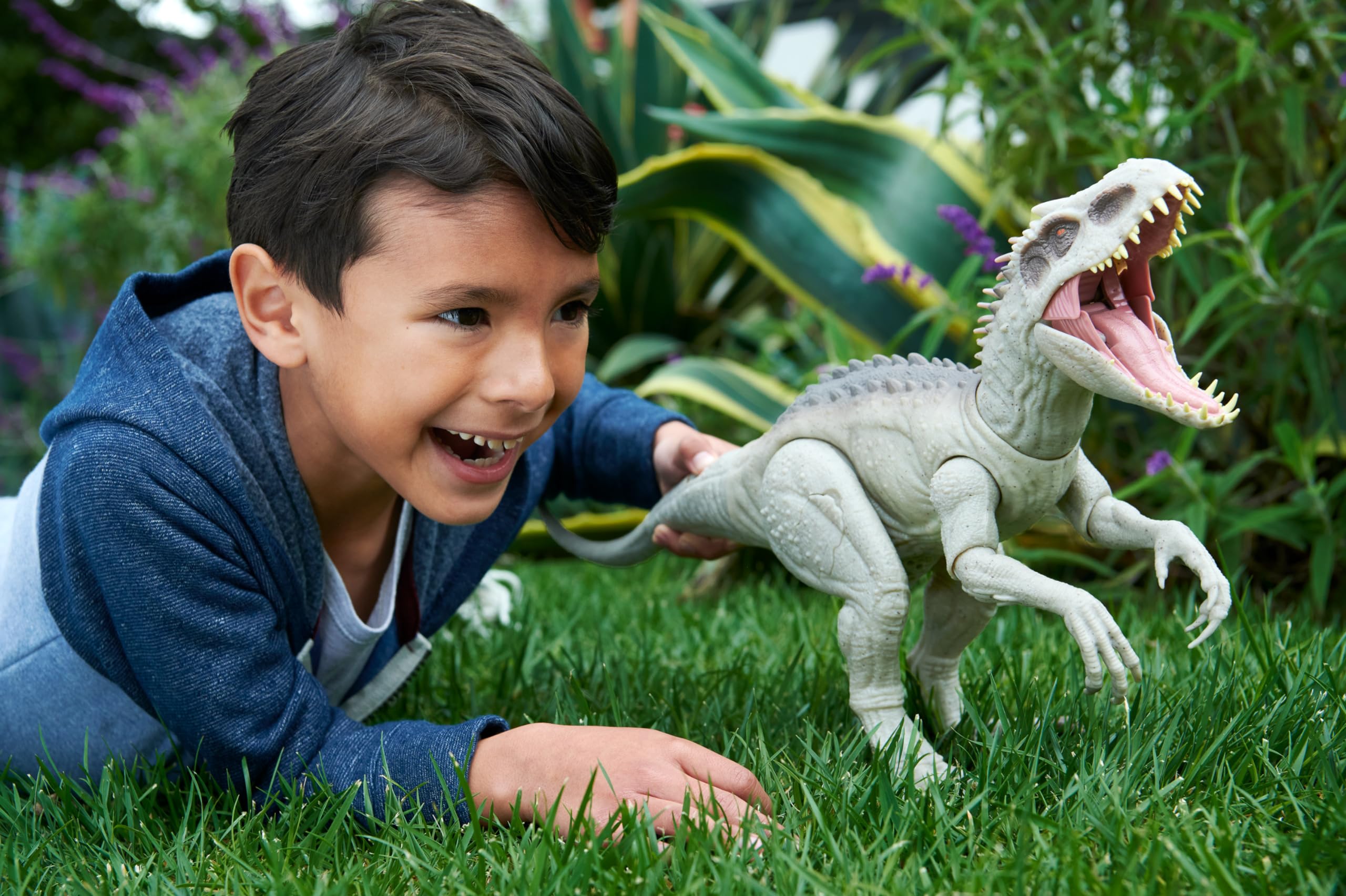 Mattel Indominus Rex tail chomp demonstrates dramatic chomping action for dynamic play.