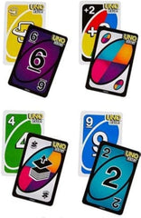 Mattel party game night setup with players enjoying a table full of cards.