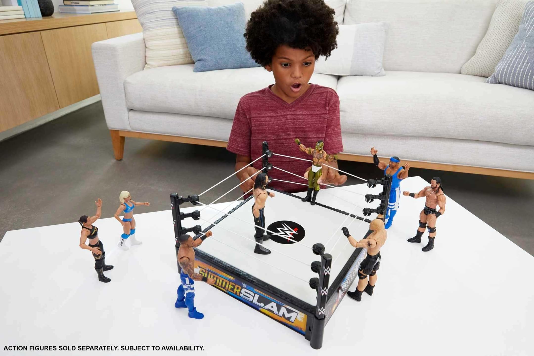 Mattel WWE Superstar Ring Spring-Loaded Mat adds bounce to slams.