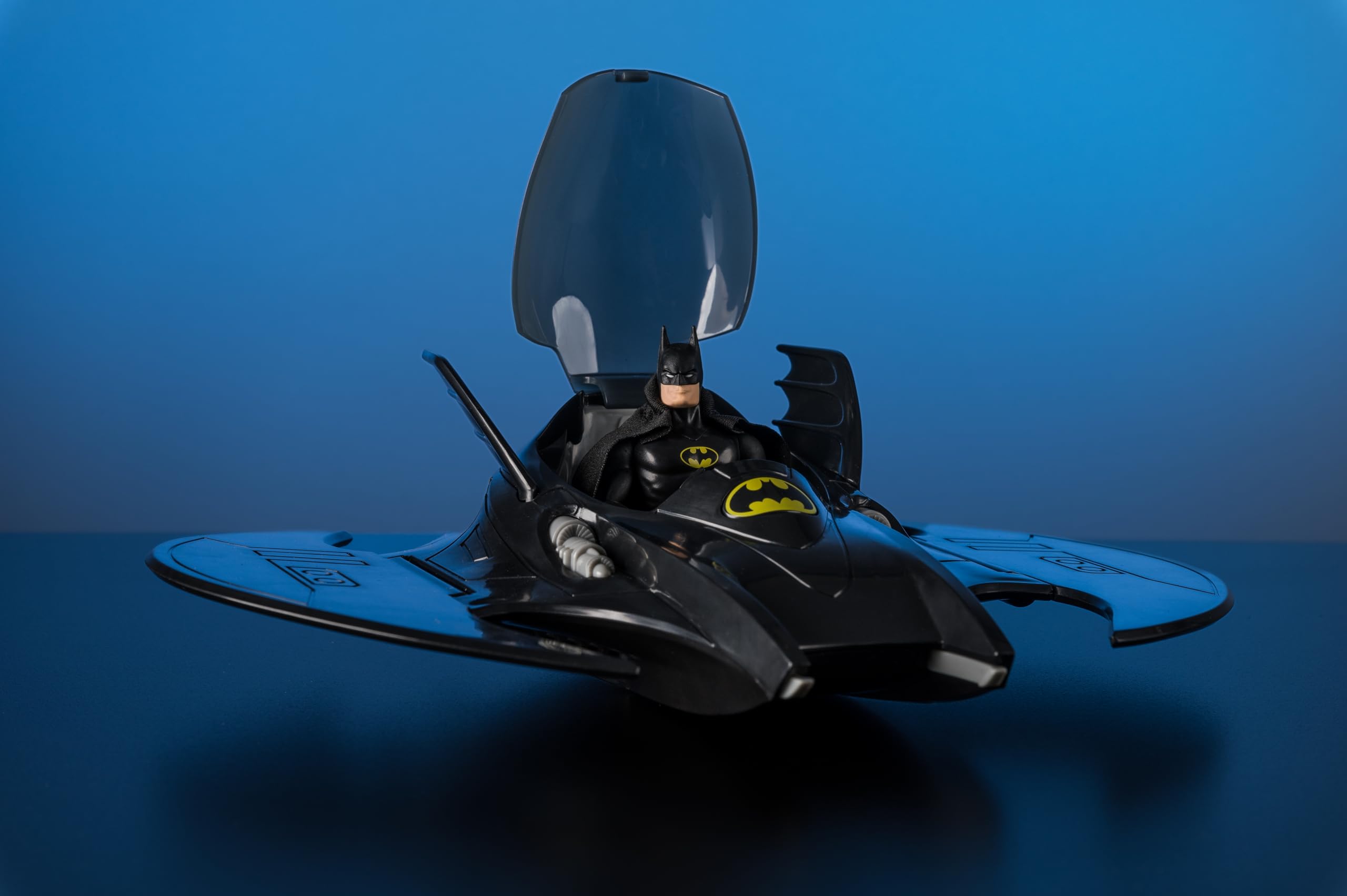 McFarlane Toys DC Super Powers Bat-Symbol cockpit opens for interactive play.