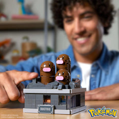 Mega Brands Dugtrio buildable figure showing interactive build experience