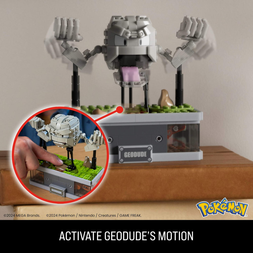 Geodude hidden button activates punching motion for interactive display.