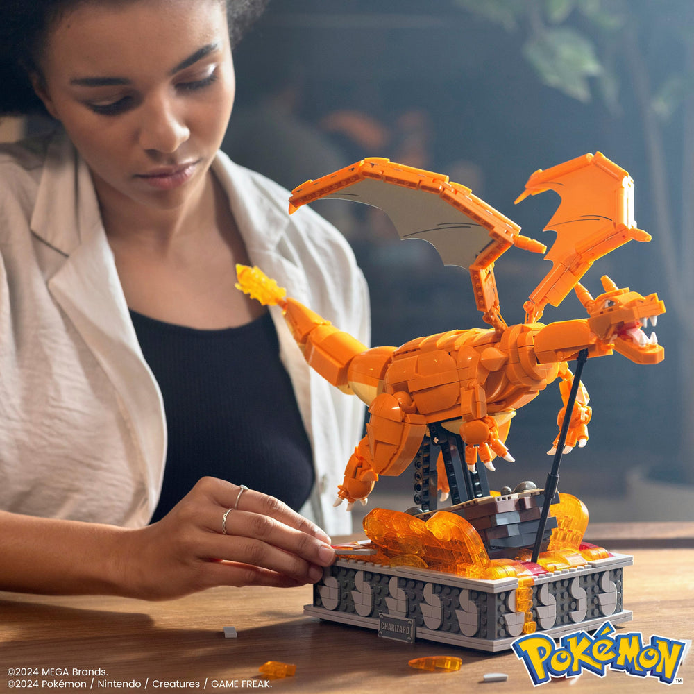 Charizard wings poised for dramatic flap as the mechanism cycles.