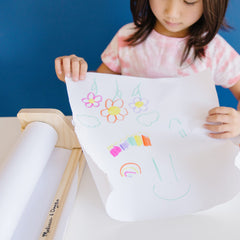 Kid-friendly design of the Melissa & Doug paper dispenser for mess-minimizing crafts.
