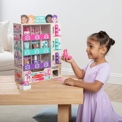 Melissa & Doug back of kiosk open for stocking showing easy restock benefit