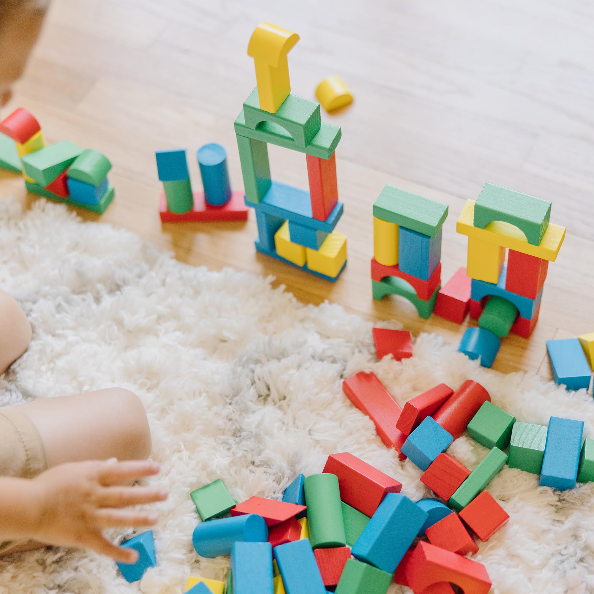 Melissa & Doug child building a tower demonstrating fine motor skill development