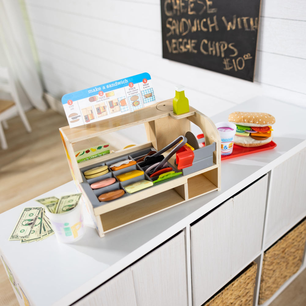 Melissa & Doug built-in toy storage helps keep play neat after sessions.