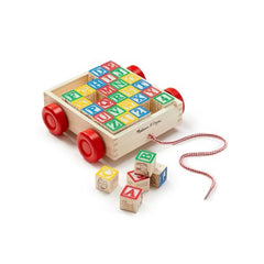 Melissa & Doug Classic ABC Block Cart child playing demonstrates stacking and fine motor skills
