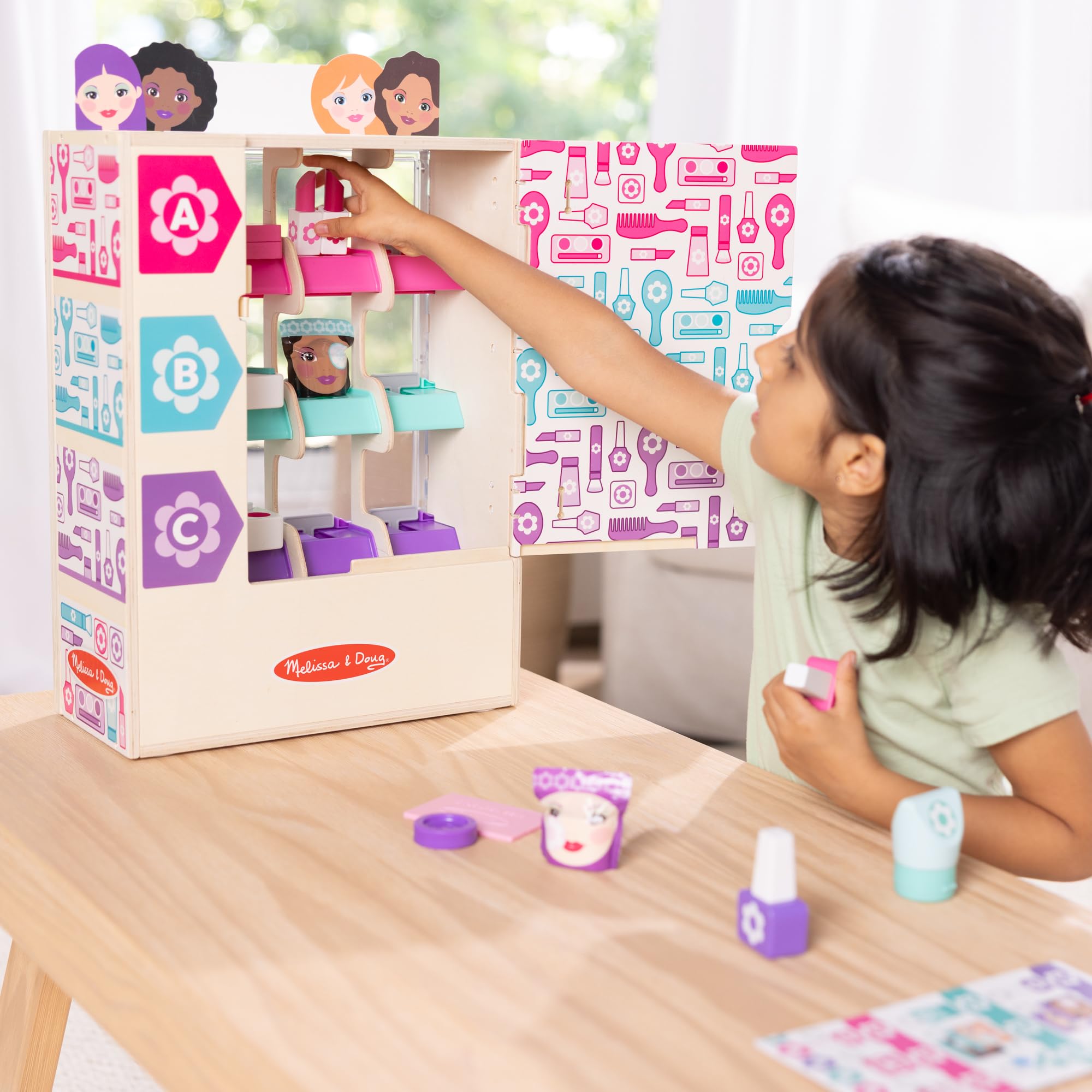 Melissa & Doug collection drawer with dispensed item showing cause-and-effect benefit
