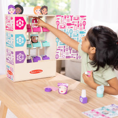 Melissa & Doug collection drawer with dispensed item showing cause-and-effect benefit