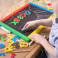 Double-sided activity board ideal for drawing, spelling, and counting.