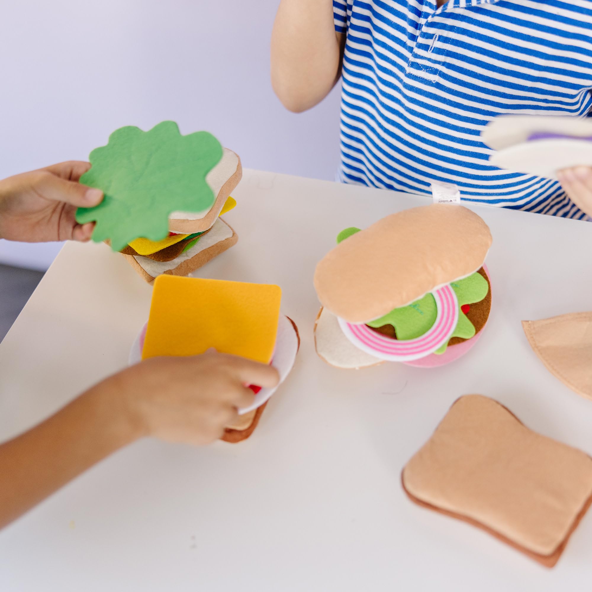 Melissa and Doug felt sandwich bread slices enable customizable pretend meals and stacking.