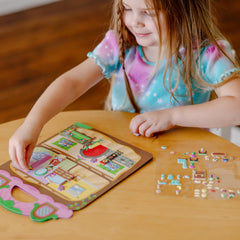 Melissa & Doug fold-out background card stores scenes neatly after play.