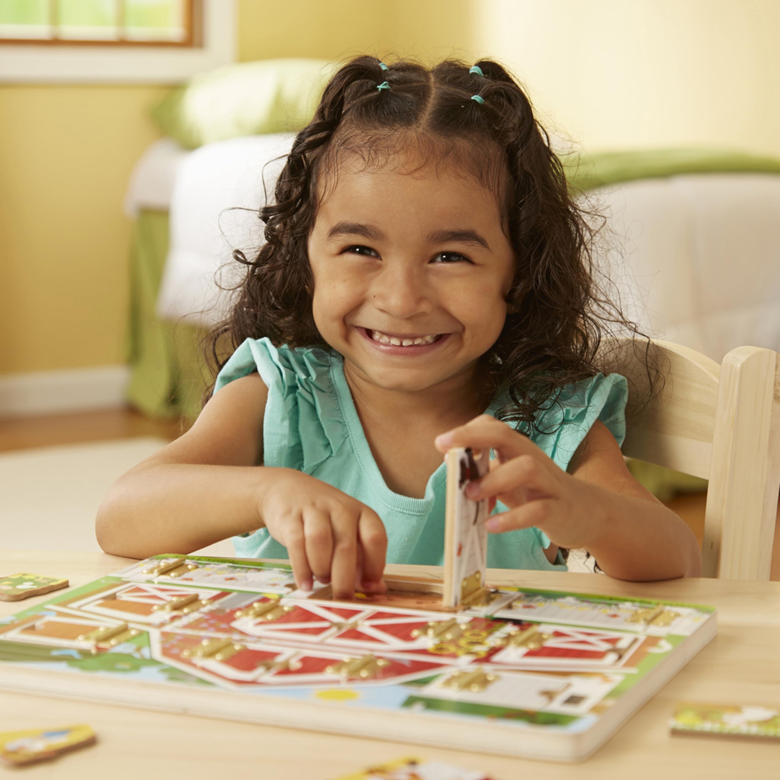 Melissa & Doug Hide and Seek Farm doors opening and closing improves fine motor control.