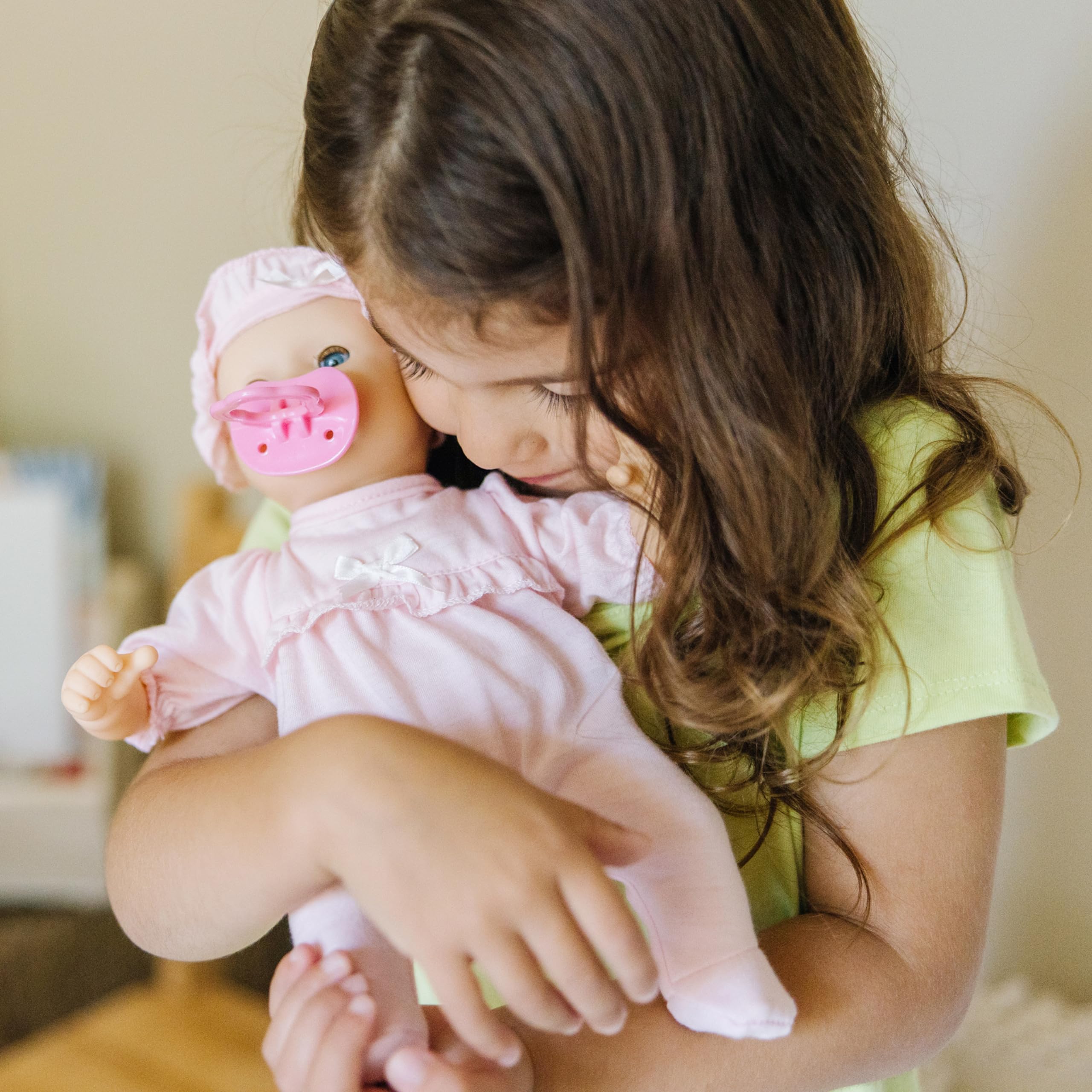 Jenna 12-inch doll thumb-sucking action supports soothing, realistic pretend play.