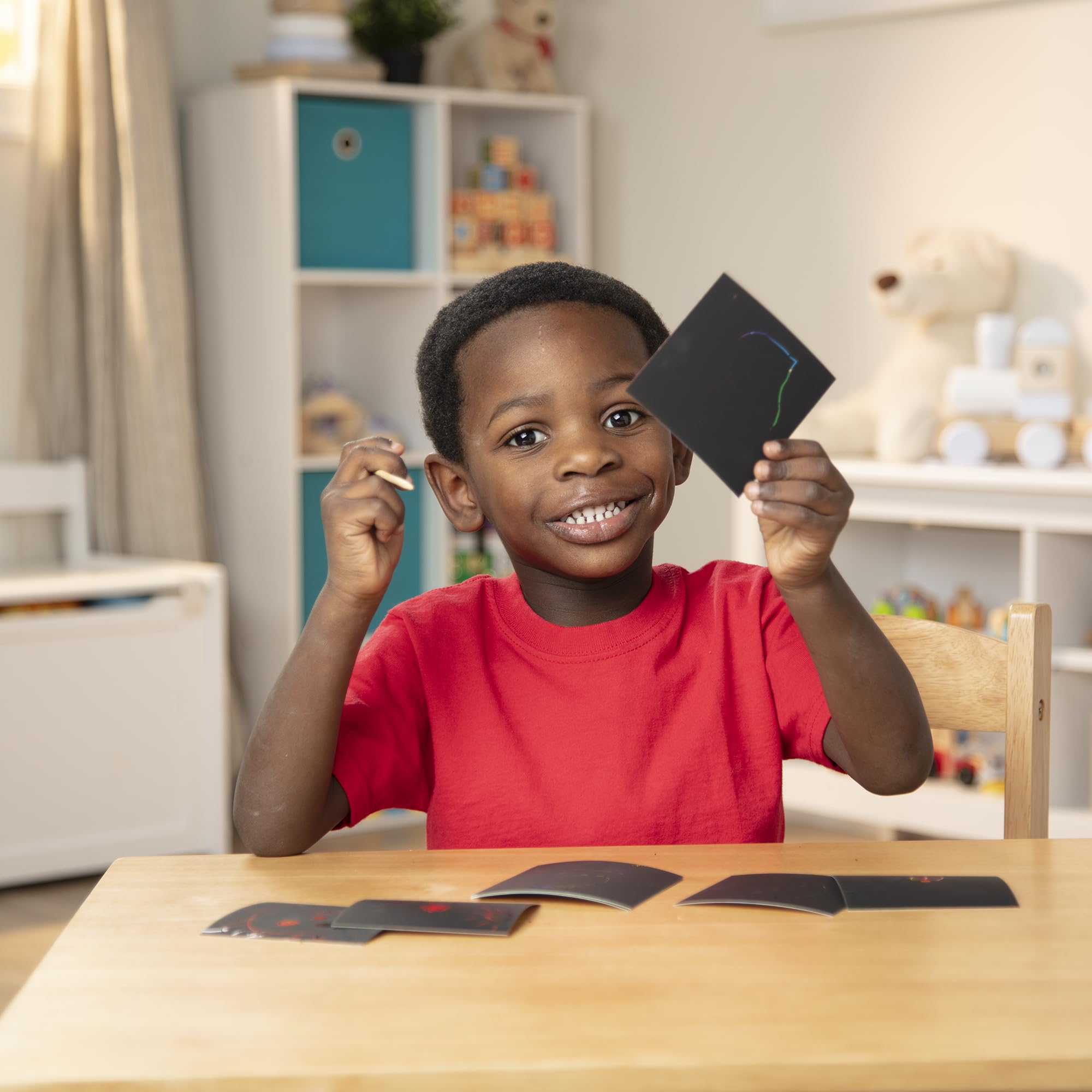Melissa & Doug Scratch Art notes encourage hands-on creativity and fine motor exploration.