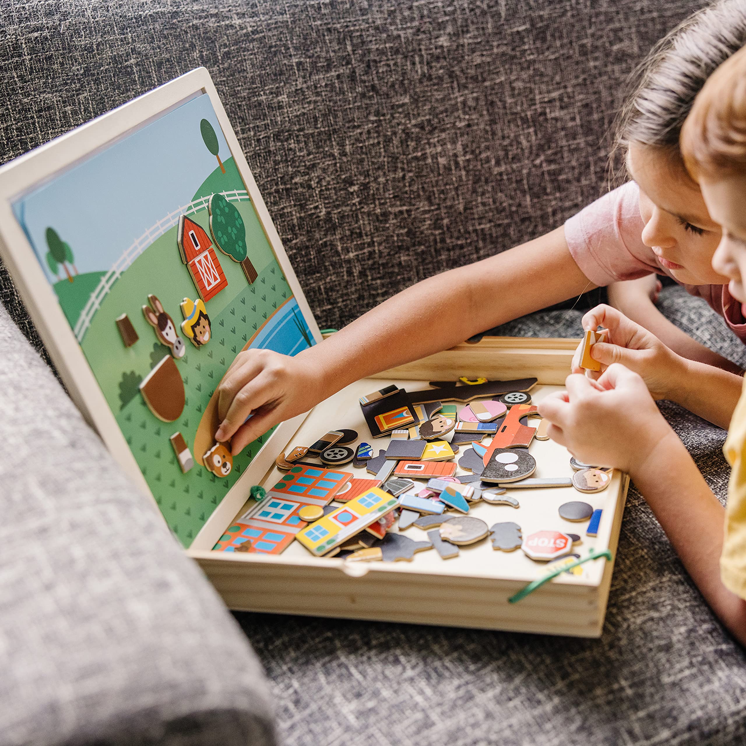 Children playing Melissa & Doug magnets to match pictures