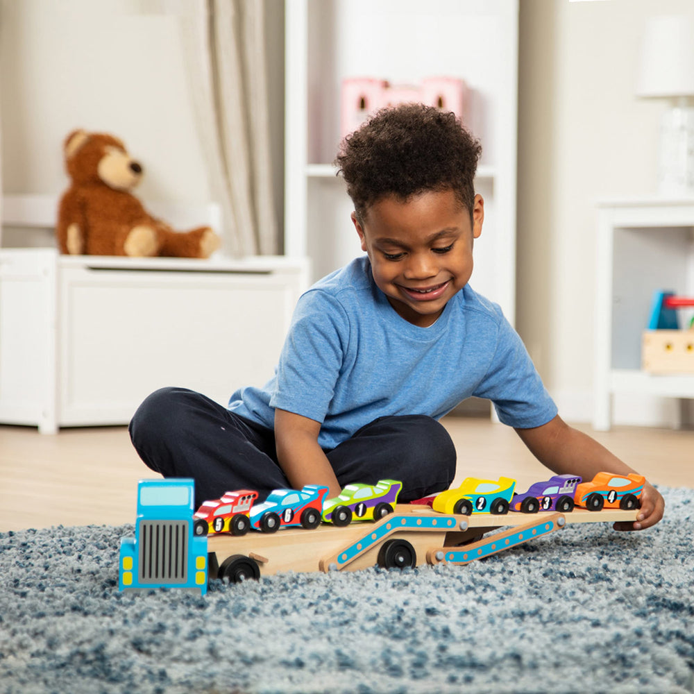 Melissa & Doug Mega Race-Car Carrier fosters fine motor skills during car-loading and unloading.