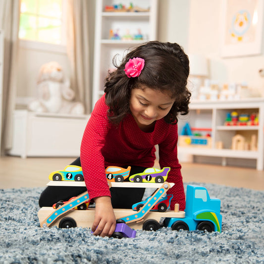 Melissa & Doug Mega Race-Car Carrier trailer with cars highlights double-decker design for exciting play.