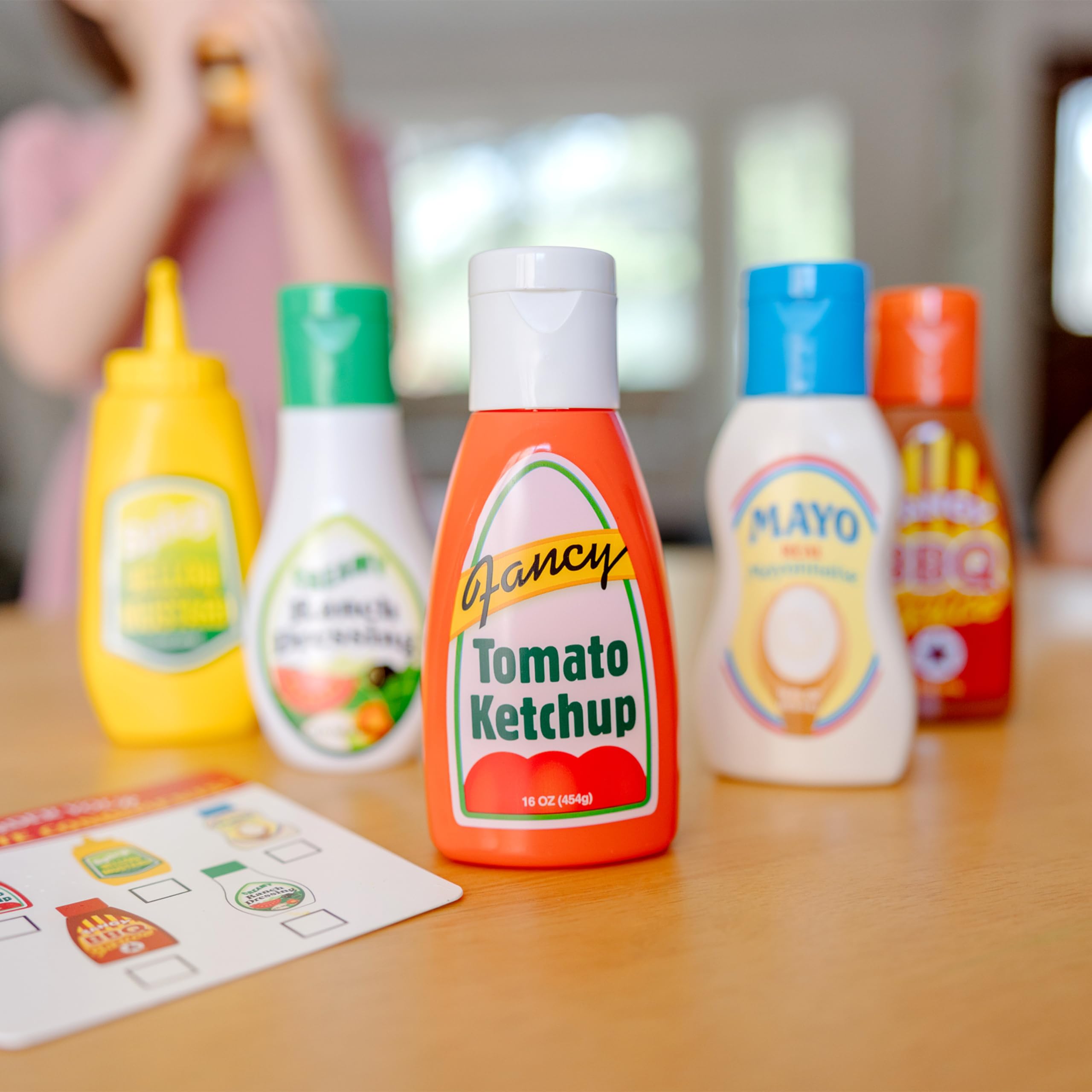 Melissa & Doug mustard bottle with squirt action enhances role play.