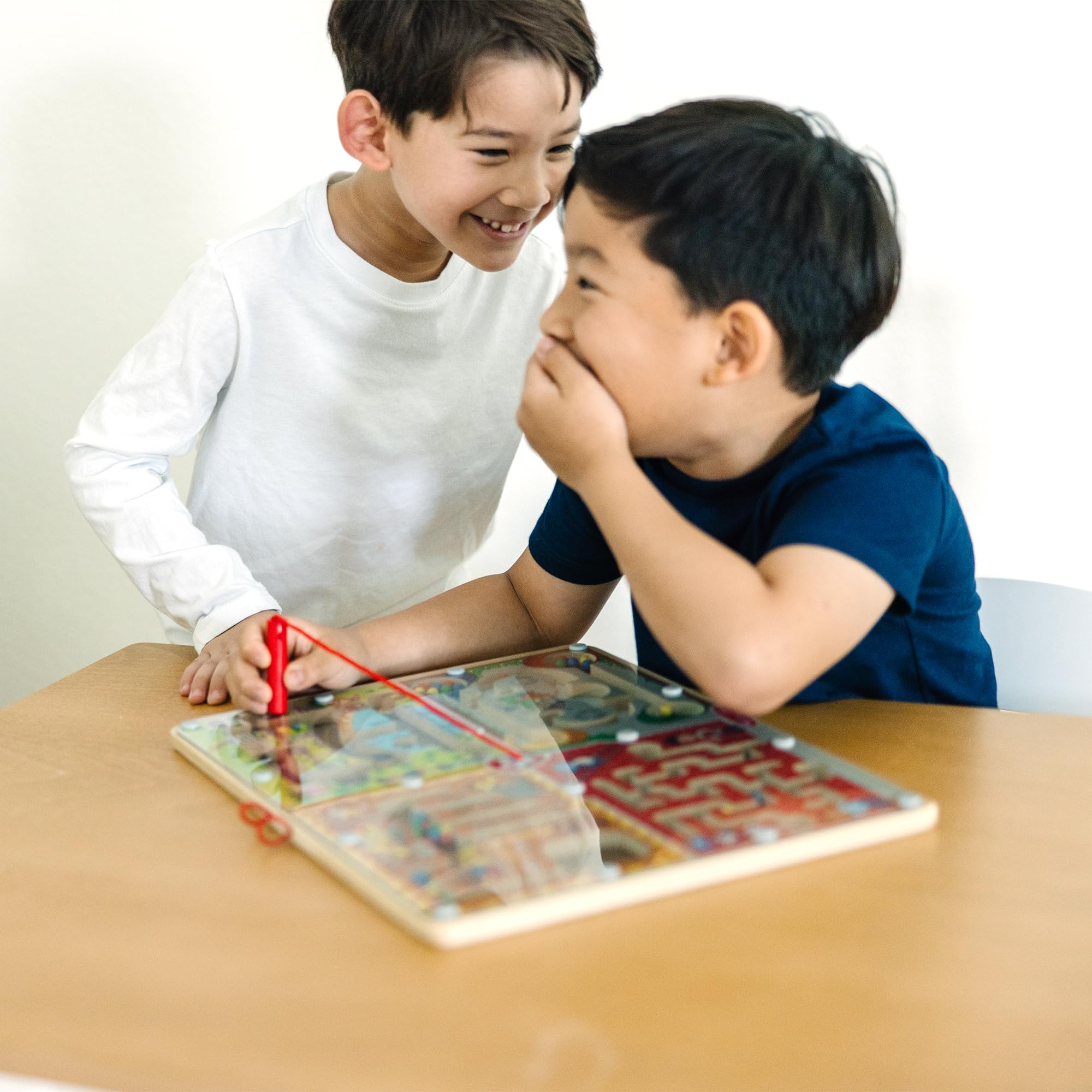 Melissa & Doug Paw Patrol maze board’s see-through cover keeps pieces in place.