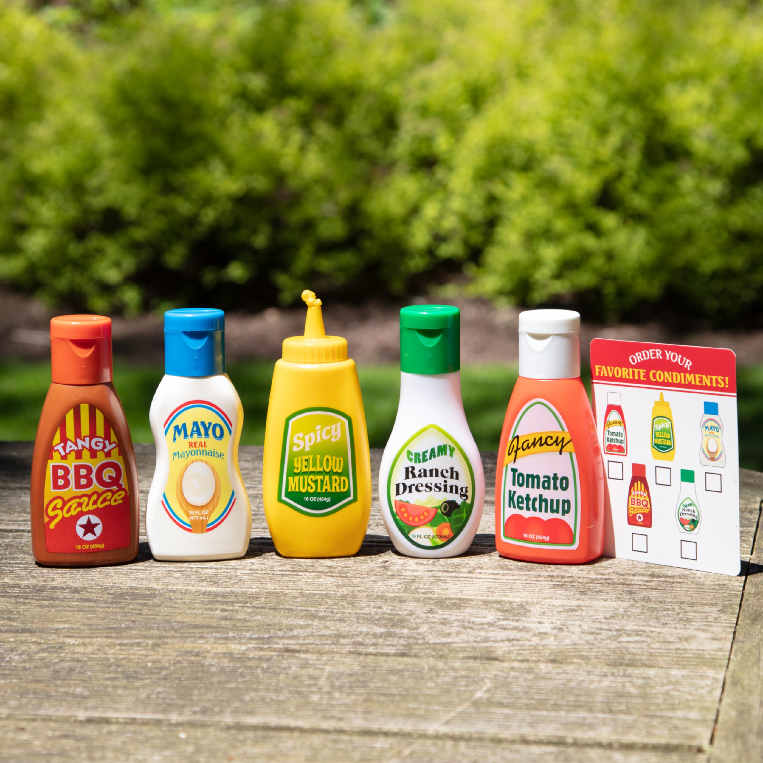 Melissa & Doug pretend picnic scene with easy-to-grip condiment bottles.
