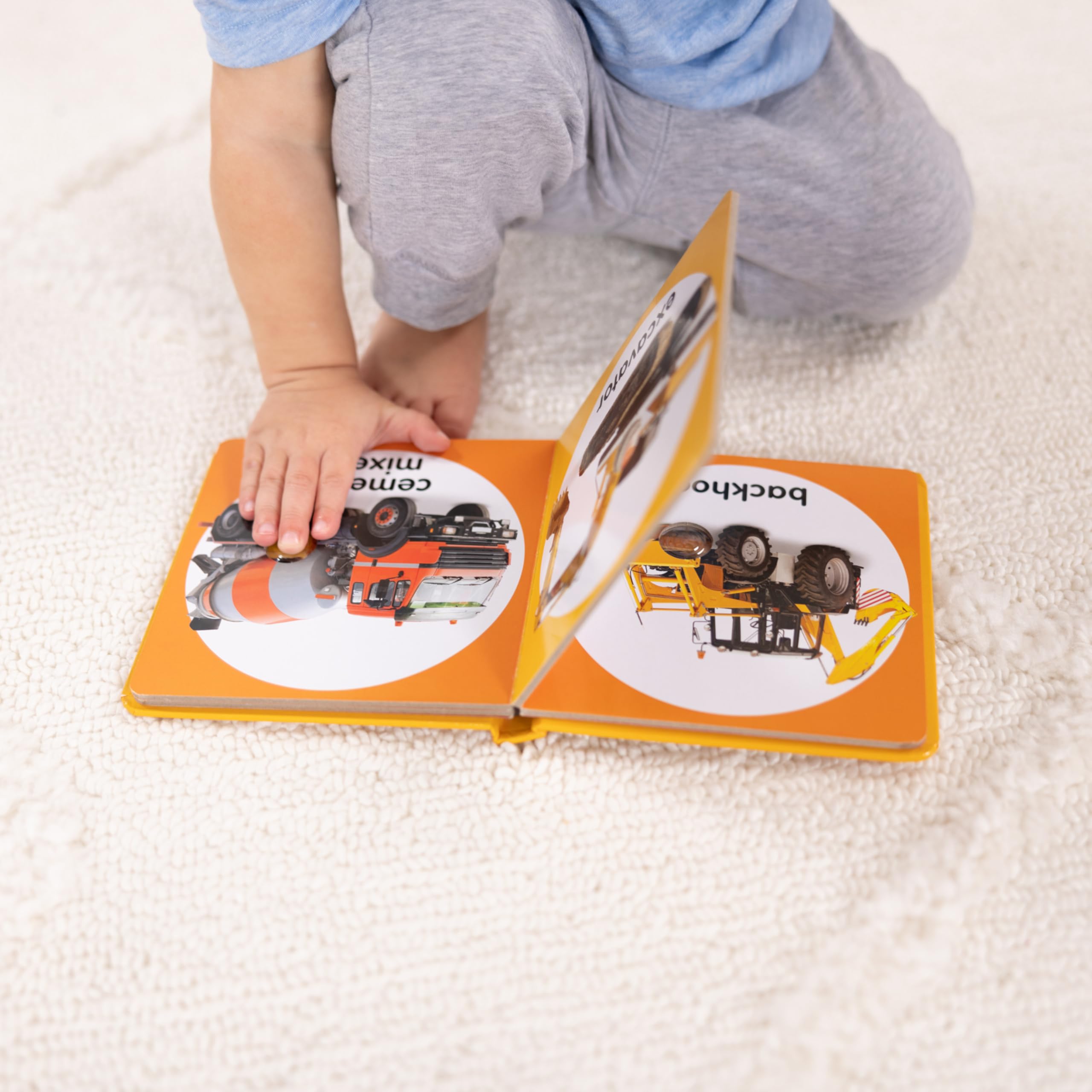Melissa & Doug Poke-a-Dot Construction Vehicles dump truck image with popping dots for fine motor skills.