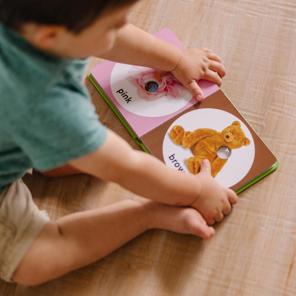 Melissa & Doug Poke-a-Dot First Colors orange carrot invites color exploration during reading