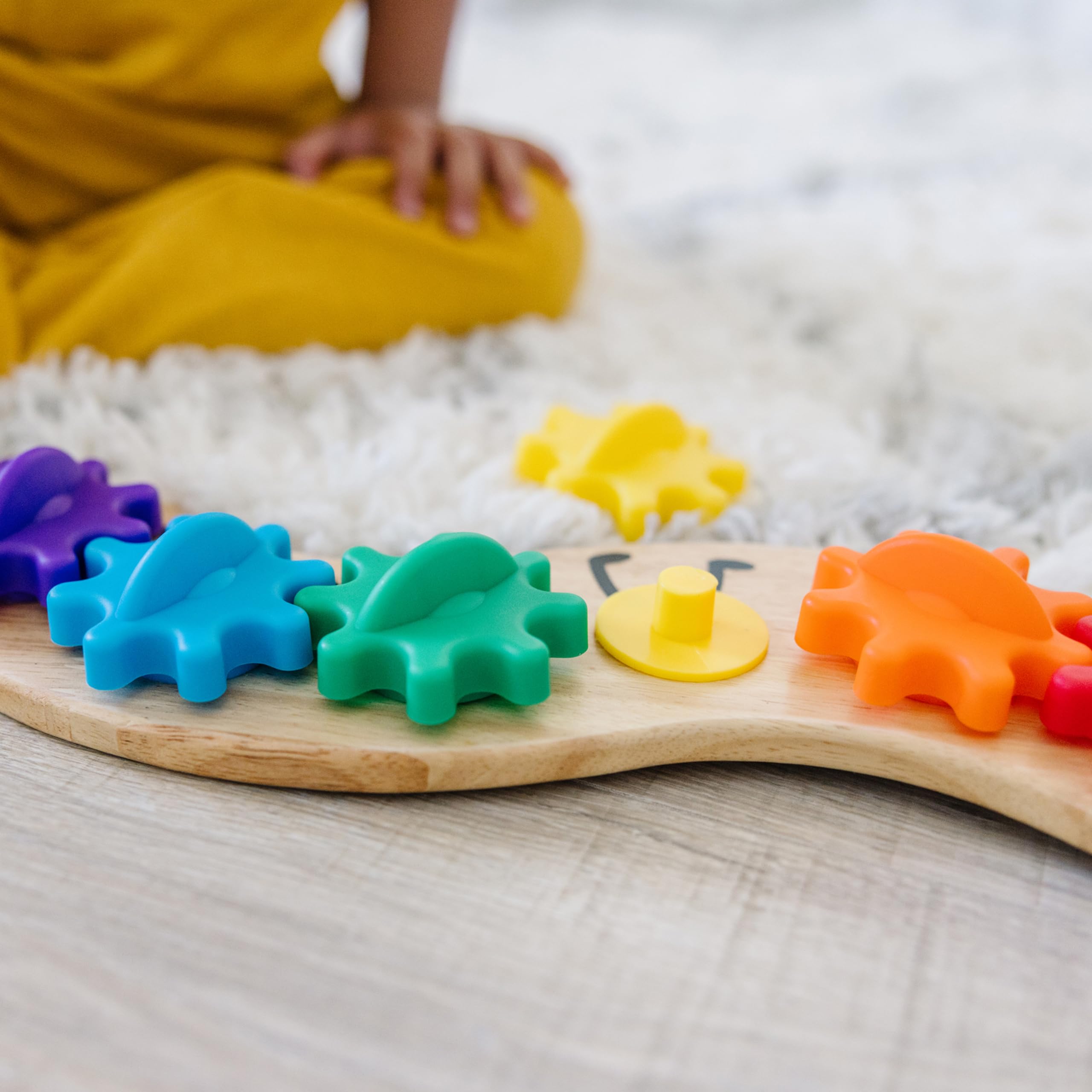 Melissa & Doug Rainbow Caterpillar Gear Toy demonstrating hand-eye coordination play.