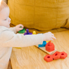Stack and Sort Board being arranged into a tower to develop coordination