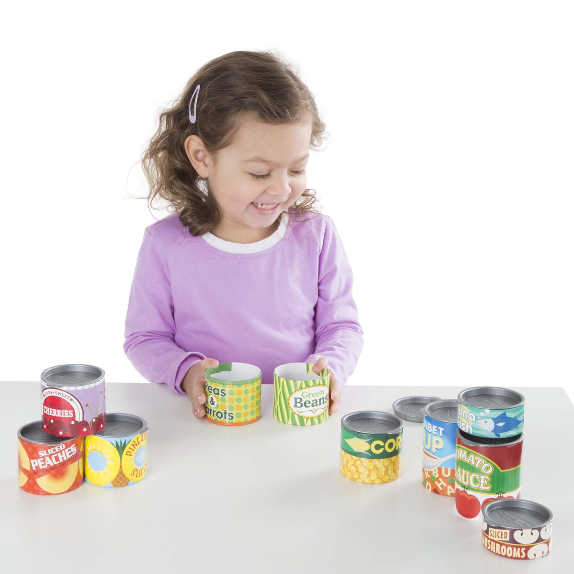 Melissa & Doug cans stored in a bin on a shelf for tidy organization and quick cleanup