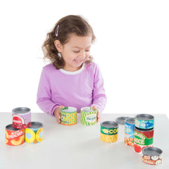 Melissa & Doug cans stored in a bin on a shelf for tidy organization and quick cleanup