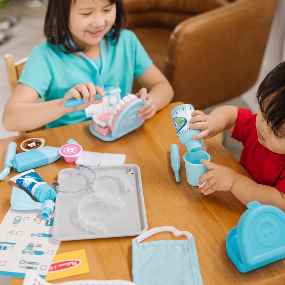 Melissa and Doug vibrating drill head demonstrates authentic tool play for kid-sized dentistry