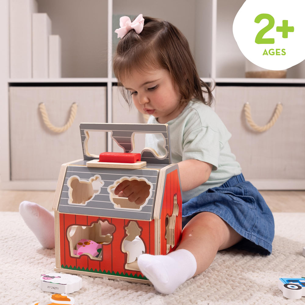 Take-Along Barn with roof open for quick access to pieces