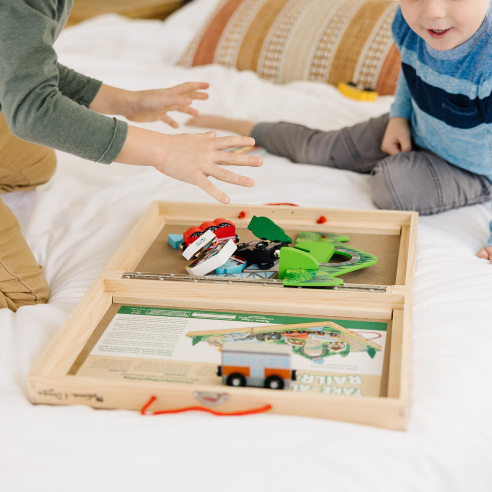 Melissa & Doug Take-Along Railroad carrying handle makes transport easy.