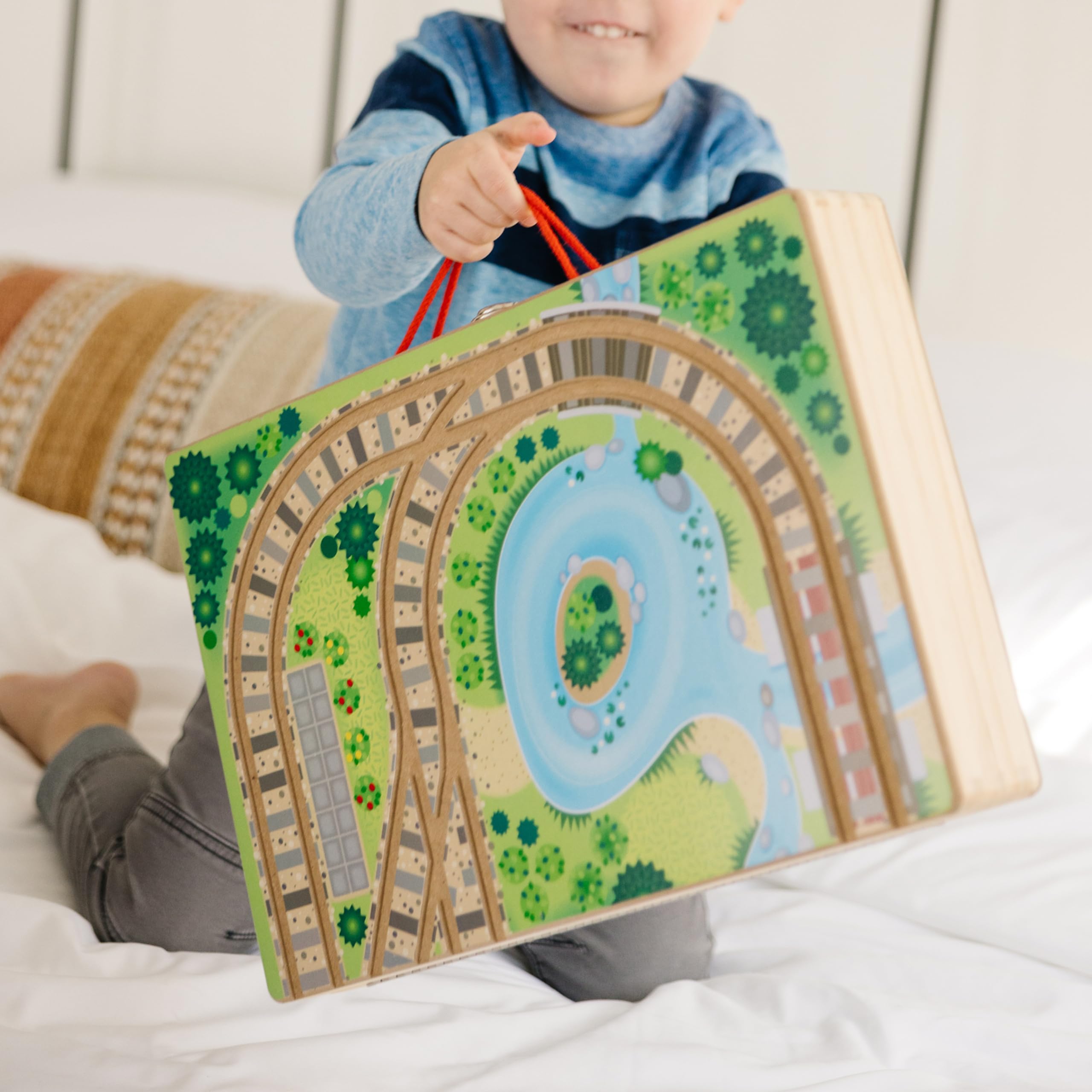 Melissa & Doug Take-Along Railroad mountain tunnel and gondola enhance dramatic pretend play.