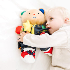 Melissa & Doug Teddy Wear bear buckles help kids practice buckle fastening skills.