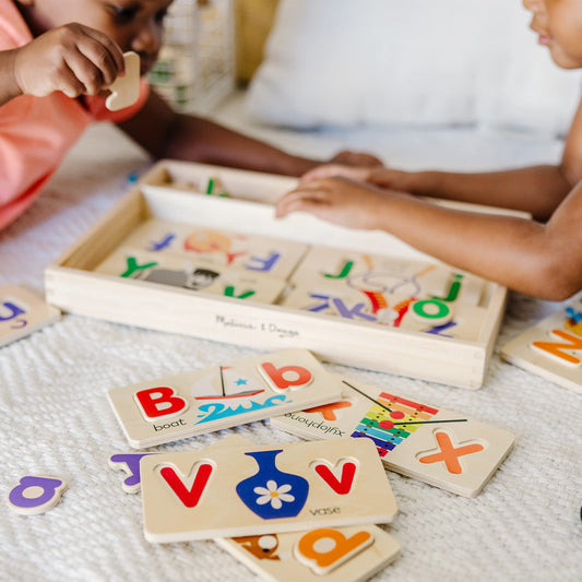 Melissa and Doug uppercase and lowercase letters on boards for letter recognition