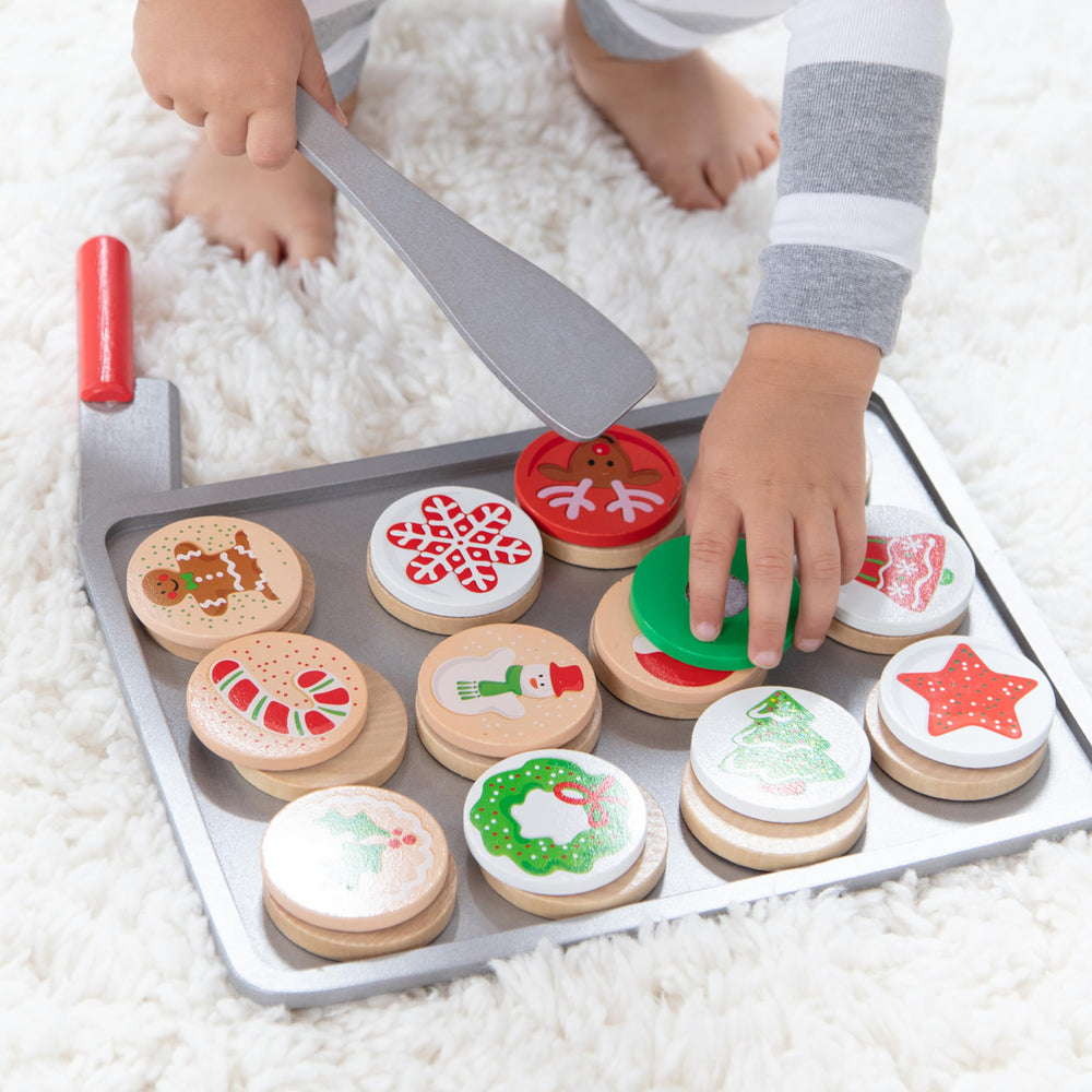 Melissa & Doug wooden knife slicing cookies promotes fine motor play.