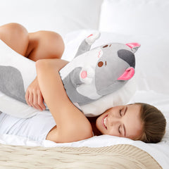 Mewaii cat plush as lumbar support on sofa for back comfort.