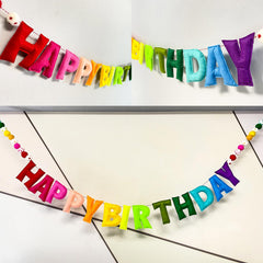 Meygajoe rainbow birthday decor brightens a playroom backdrop.
