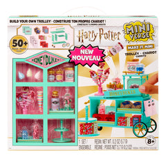 MGA's Miniverse Make It Mini Honeydukes Trolley pieces ready for display.